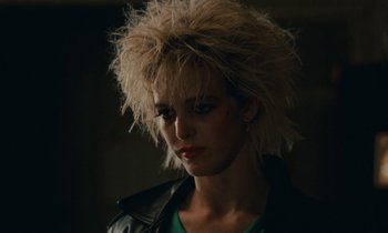 Movie still from “So Long, Stooge” (1983), directed by Claude Berri – A person wearing a leather jacket; Close Up shot, Low angle