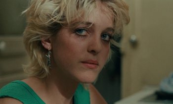 Movie still from “So Long, Stooge” (1983), directed by Claude Berri – A person wearing a green shirt; Close Up shot, Over the shoulder angle