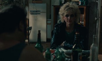 Movie still from “So Long, Stooge” (1983), directed by Claude Berri – A woman sitting at a table in front of a man; Close Up shot, Over the shoulder angle