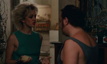 Movie still from “So Long, Stooge” (1983), directed by Claude Berri – A man and a woman are talking in a kitchen; Medium shot, Over the shoulder angle