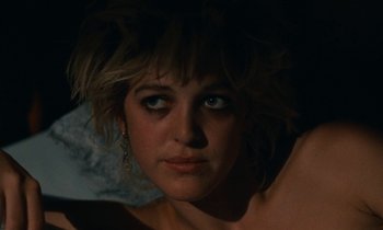 Movie still from “So Long, Stooge” (1983), directed by Claude Berri – A person's face in the dark; Close Up shot, Low angle