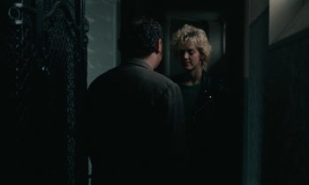 Movie still from “So Long, Stooge” (1983), directed by Claude Berri – A man and a woman standing in front of a mirror; Medium shot, Over the shoulder angle