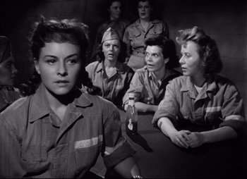 Movie still from “So Proudly We Hail” (1990), directed by Lionel Chetwynd – A black and white photo of a group of women; Medium shot, Low angle