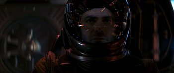 Movie still from “Solaris” (2002), directed by Steven Soderbergh – A man wearing a space helmet in a dark room; Close Up shot, Low angle