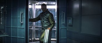Movie still from “Solaris” (2002), directed by Steven Soderbergh – A man in a space suit holding a suitcase; Medium shot, High angle