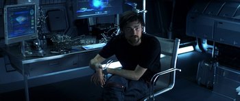 Movie still from “Solaris” (2002), directed by Steven Soderbergh – A man sitting in front of a computer monitor; Medium shot, High angle