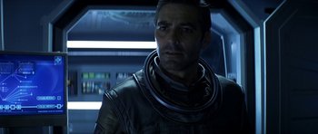 Movie still from “Solaris” (2002), directed by Steven Soderbergh – A person wearing a space suit; Close Up shot, Over the shoulder angle