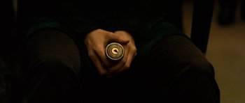 Movie still from “Solaris” (2002), directed by Steven Soderbergh – A person holding a drink in their hands; Extreme Close Up shot, Overhead angle