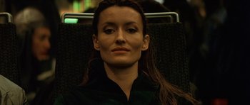 Movie still from “Solaris” (2002), directed by Steven Soderbergh – A person sitting in a chair; Close Up shot, Low angle