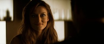 Movie still from “Solaris” (2002), directed by Steven Soderbergh – A person with long brown hair; Close Up shot, Over the shoulder angle