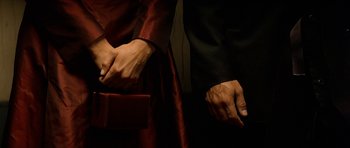 Movie still from “Solaris” (2002), directed by Steven Soderbergh – A man and a woman holding each other's hands; Extreme Close Up shot, Overhead angle