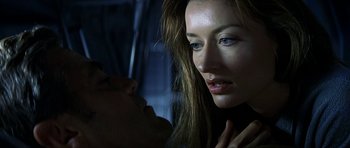 Movie still from “Solaris” (2002), directed by Steven Soderbergh – A woman looking at a mans face; Close Up shot, Over the shoulder angle