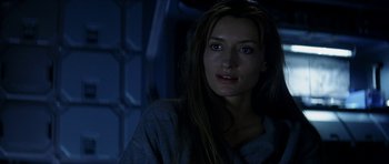 Movie still from “Solaris” (2002), directed by Steven Soderbergh – A person with long brown hair; Close Up shot, Over the shoulder angle