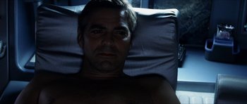 Movie still from “Solaris” (2002), directed by Steven Soderbergh – A man laying in a bed with his chest exposed; Close Up shot, Overhead angle
