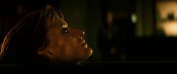 Movie still from “Solaris” (2002), directed by Steven Soderbergh – A woman looking up into the sky at night; Close Up shot, Low angle