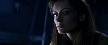 Movie still from “Solaris” (2002), directed by Steven Soderbergh – A person with long brown hair; Close Up shot, Over the shoulder angle