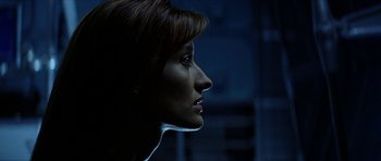 Movie still from “Solaris” (2002), directed by Steven Soderbergh – A woman's face in the dark; Close Up shot, Low angle