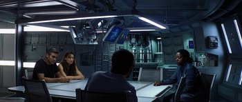Movie still from “Solaris” (2002), directed by Steven Soderbergh – A group of people sitting at a table in a room; Medium shot, Over the shoulder angle