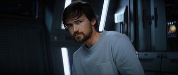 Movie still from “Solaris” (2002), directed by Steven Soderbergh – A person with a beard; Close Up shot, Over the shoulder angle