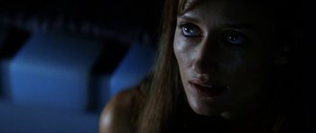 Movie still from “Solaris” (2002), directed by Steven Soderbergh – A woman's face in the dark; Close Up shot, Low angle