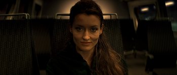 Movie still from “Solaris” (2002), directed by Steven Soderbergh – A person on a train; Close Up shot, High angle