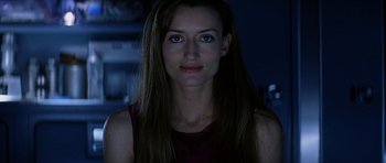 Movie still from “Solaris” (2002), directed by Steven Soderbergh – A beautiful woman with long brown hair wearing a red shirt; Close Up shot, Over the shoulder angle