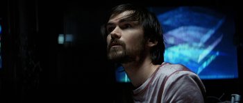 Movie still from “Solaris” (2002), directed by Steven Soderbergh – A person with long hair and a beard; Close Up shot, Low angle