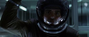 Movie still from “Solaris” (2002), directed by Steven Soderbergh – A person wearing a helmet; Close Up shot, Low angle