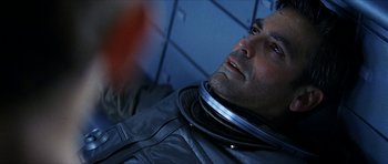 Movie still from “Solaris” (2002), directed by Steven Soderbergh – A person wearing a space suit; Close Up shot, Overhead angle