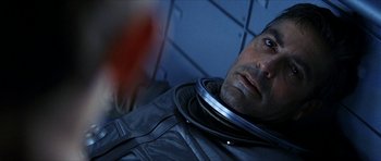 Movie still from “Solaris” (2002), directed by Steven Soderbergh – A person wearing a space suit; Close Up shot, Overhead angle
