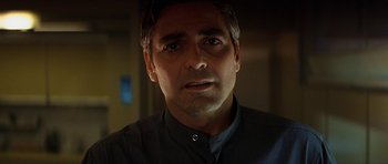 Movie still from “Solaris” (2002), directed by Steven Soderbergh – A man's face in a dark room; Close Up shot, Low angle