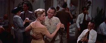 Movie still from “Some Came Running” (1958), directed by Vincente Minnelli – A man and a woman are dancing in a room; Medium shot, Low angle