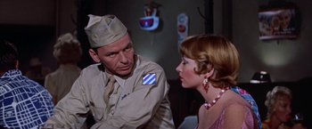 Movie still from “Some Came Running” (1958), directed by Vincente Minnelli – A man and a woman are talking to each other; Medium shot, Over the shoulder angle