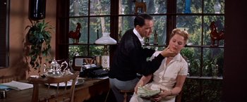 Movie still from “Some Came Running” (1958), directed by Vincente Minnelli – A man and a woman in a living room; Medium shot, Low angle