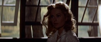 Movie still from “Some Came Running” (1958), directed by Vincente Minnelli – A beautiful woman with blonde hair and blue eyes; Close Up shot, Low angle