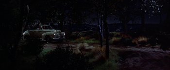 Movie still from “Some Came Running” (1958), directed by Vincente Minnelli – A truck parked in the middle of a field at night; Extreme Wide shot, High angle