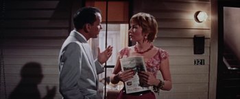 Movie still from “Some Came Running” (1958), directed by Vincente Minnelli – A man and a woman talking to each other; Medium shot, Over the shoulder angle