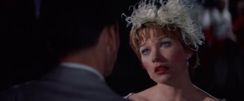 Movie still from “Some Came Running” (1958), directed by Vincente Minnelli – A man and a woman looking at one another in the dark; Close Up shot, Over the shoulder angle