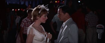 Movie still from “Some Came Running” (1958), directed by Vincente Minnelli – A man and a woman are talking to each other; Close Up shot, Over the shoulder angle