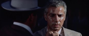Movie still from “Some Came Running” (1958), directed by Vincente Minnelli – A man that is looking at a man in a hat; Close Up shot, Over the shoulder angle