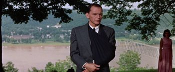 Movie still from “Some Came Running” (1958), directed by Vincente Minnelli – A man in a suit and a black tie; Medium shot, Low angle