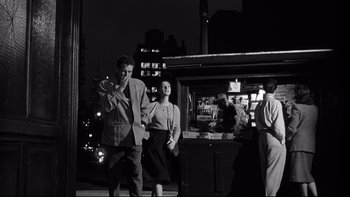 Movie still from “Somebody Up There Likes Me” (1956), directed by Robert Wise – A black and white photo of a man and a woman; Medium shot, Low angle