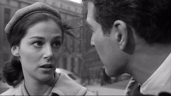 Movie still from “Somebody Up There Likes Me” (1956), directed by Robert Wise – A man and a woman talking on the street; Close Up shot, Over the shoulder angle