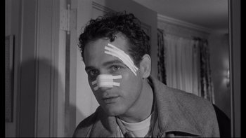Movie still from “Somebody Up There Likes Me” (1956), directed by Robert Wise – A man with bandages all over his face; Close Up shot, Low angle