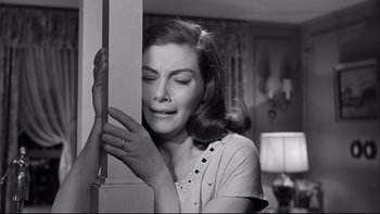 Movie still from “Somebody Up There Likes Me” (1956), directed by Robert Wise – A black - and - white photo of a woman crying; Close Up shot, High angle