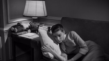 Movie still from “Somebody Up There Likes Me” (1956), directed by Robert Wise – A black and white photo of a woman holding a pillow; Medium shot, High angle