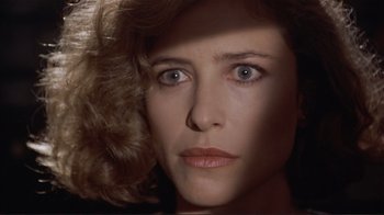Movie still from “Someone to Watch Over Me” (1987), directed by Ridley Scott – A woman's eyes and face; Close Up shot, Over the shoulder angle