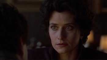 Movie still from “Someone to Watch Over Me” (1987), directed by Ridley Scott – A person wearing a black jacket; Close Up shot, Over the shoulder angle