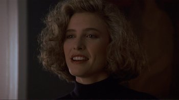 Movie still from “Someone to Watch Over Me” (1987), directed by Ridley Scott – A person wearing a black shirt; Close Up shot, Over the shoulder angle