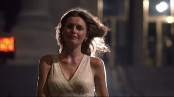 Movie still from “Something's Gotta Give” (2003), directed by Nancy Meyers – A woman in a white dress is standing in the dark; Close Up shot, Low angle